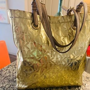 Beautiful gold signature Michel Kors purse
